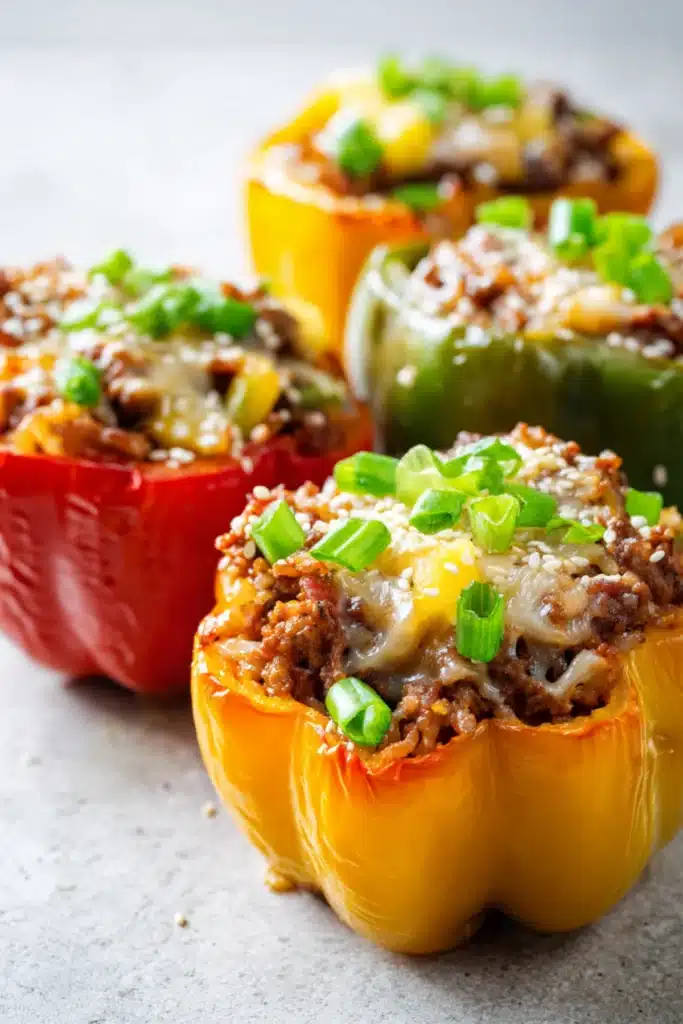 Juicy bell peppers filled with teriyaki chicken, pineapple, and melted cheese, topped with fresh green onions.

