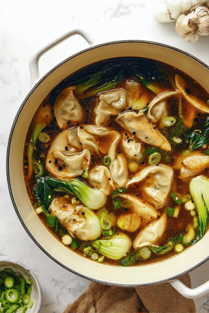 Potsticker Soup flavorful dark broth filled with dumplings, bok choy,