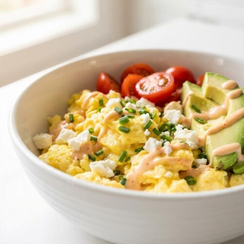 High protein breakfast meal prep egg bowls — hero featured shot — finished dish top-down on white plate